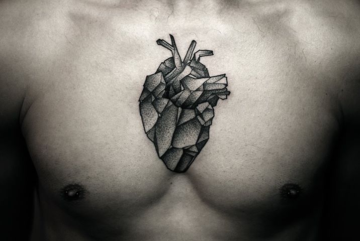 Black And Grey Dotwork Real Heart Tattoo On Man Chest
