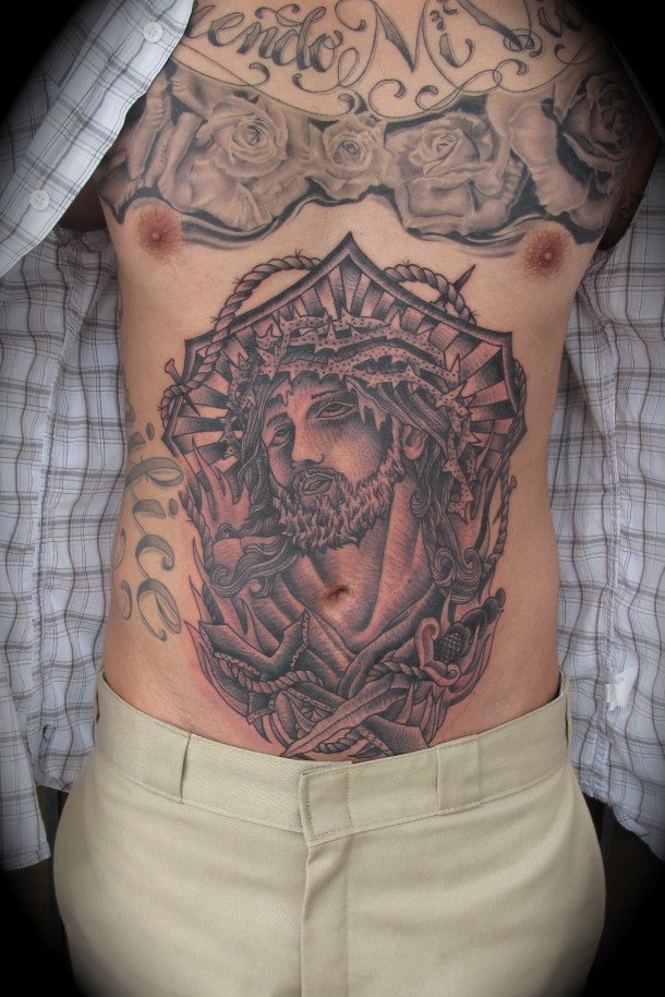 Black And Grey Jesus Face Tattoo On Man Stomach