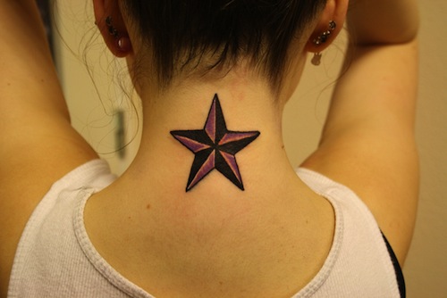 Black And Grey Nautical Star Tattoo On Girl Back Neck