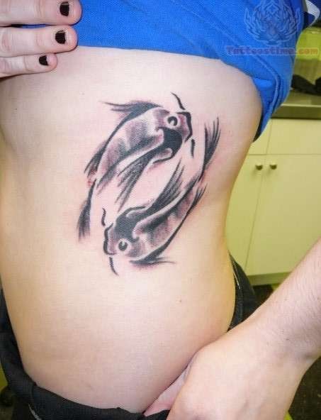 Black And Grey Pisces Tattoo On Girl Side Rib