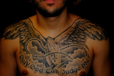 Black And Grey Praying Hands With Wings Tattoo On Man Chest