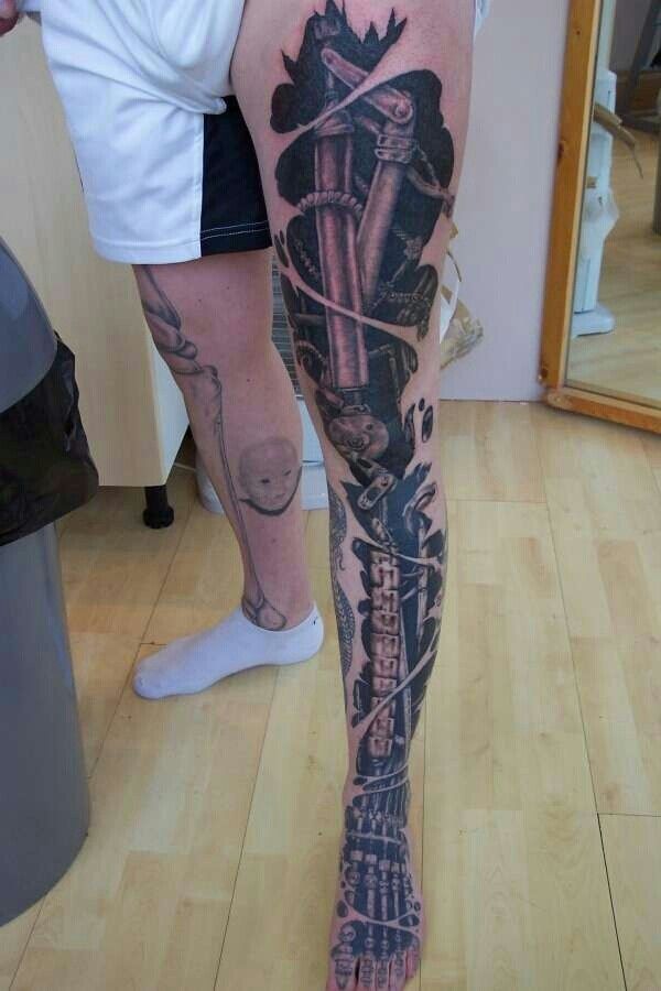 Black And Grey Ripped Skin Biomechanical Tattoo On Full Leg