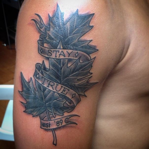 Black And Grey Three Maple Leaf With Banner Tattoo On Shoulder