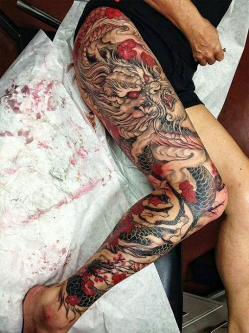 Black And Red Dragon With Flowers Tattoo On Right Full Leg