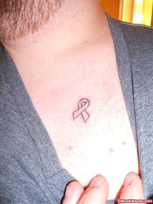 Black Cancer Ribbon Tattoo On Collarbone