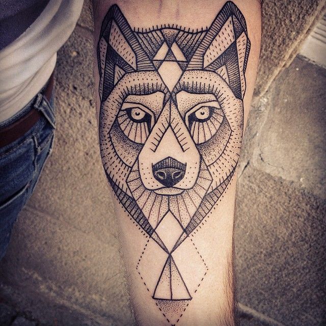 Black Ink Geometric Wolf Head Tattoo On Forearm