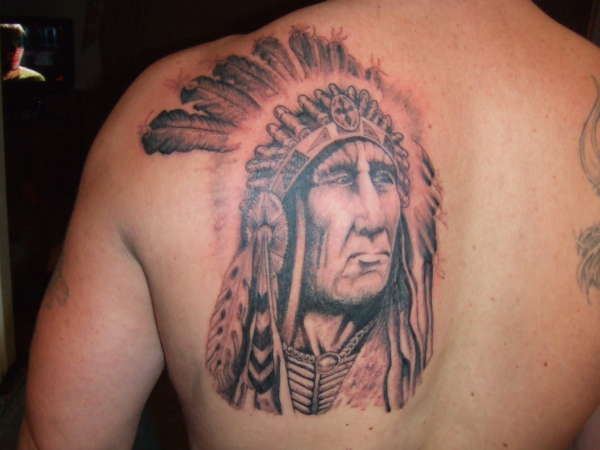 Black Ink Indian Native Tattoo On Man Left Back Shoulder