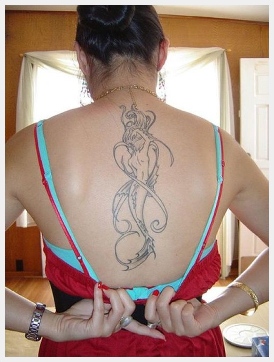 Black Ink Mermaid Tattoo On Girl Upper Back