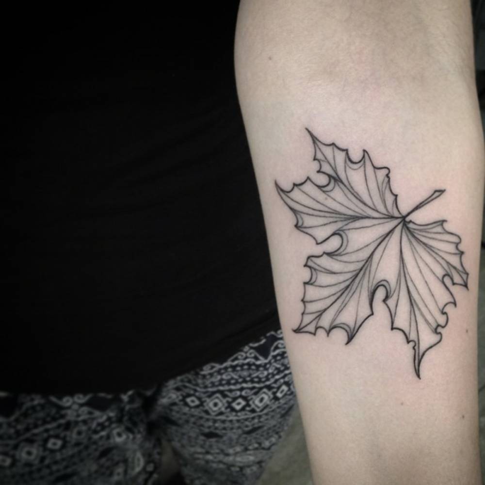 Black Maple Leaf Tattoo On Forearm