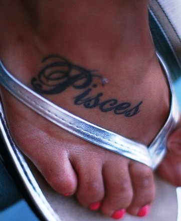 Black Pisces Tattoo On Girl Foot