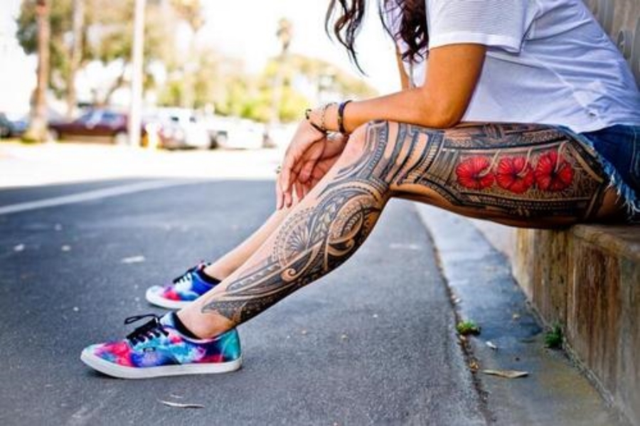Black Polynesian Design With Three Flowers Tattoo On Girl Full Leg