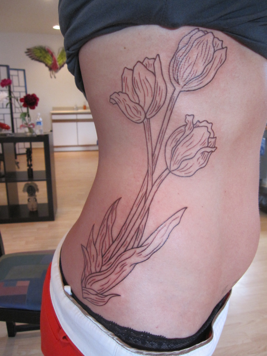 Black Three Tulip Flowers Tattoo On Side Rib