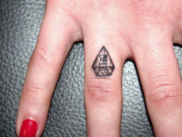 Black Tiny Prism Tattoo On Girl Finger