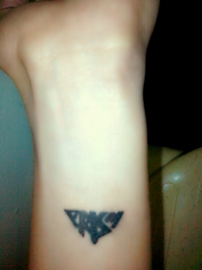 Black Tribal Prism Tattoo On Wrist