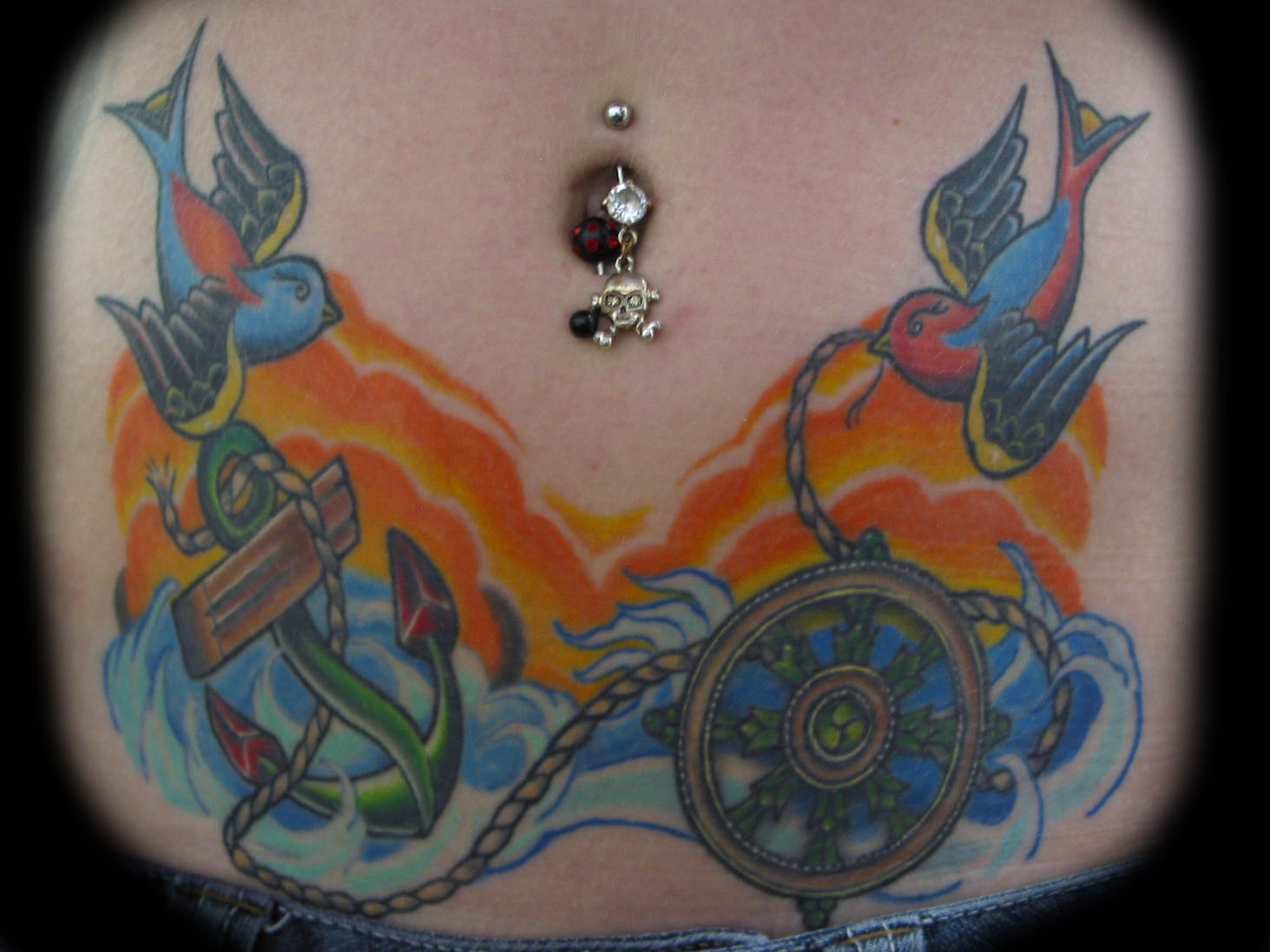 Colorful Anchor With Wheel And Two Flying Birds Tattoo On Stomach