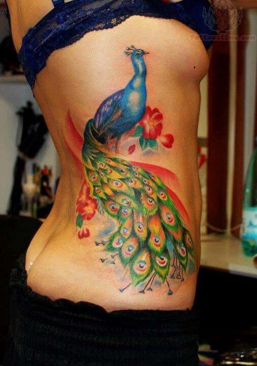 Colorful Peacock With Flowers Tattoo On Girl Side Rib