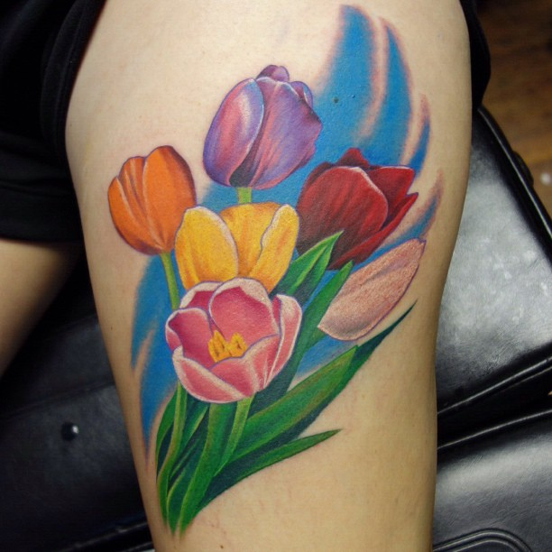 Colorful Tulip Flowers Tattoo On Thigh