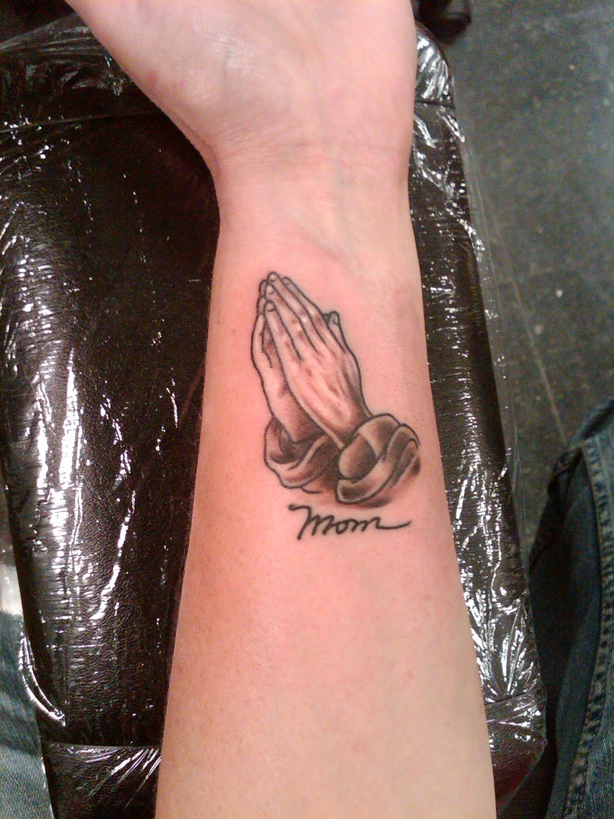 Grey Ink 3D Praying Hands Tattoo On Wrist