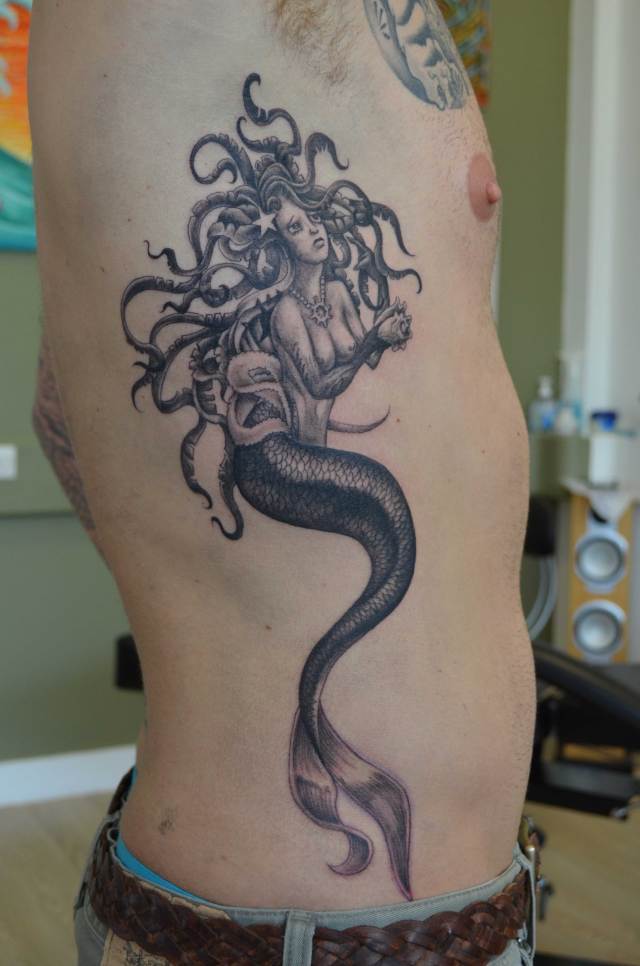 Grey Ink Mermaid Tattoo On Man Side Rib