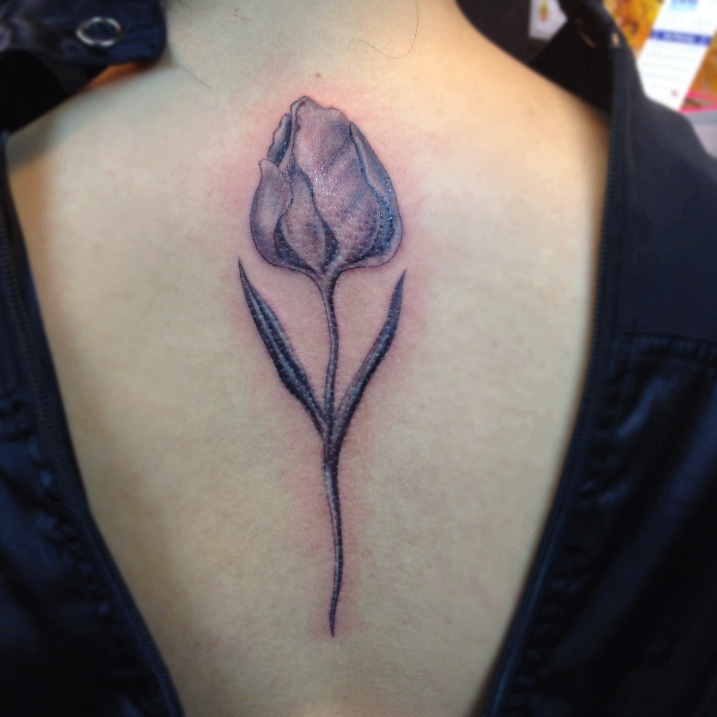 Grey Ink Tulip Tattoo Design For Upper Back