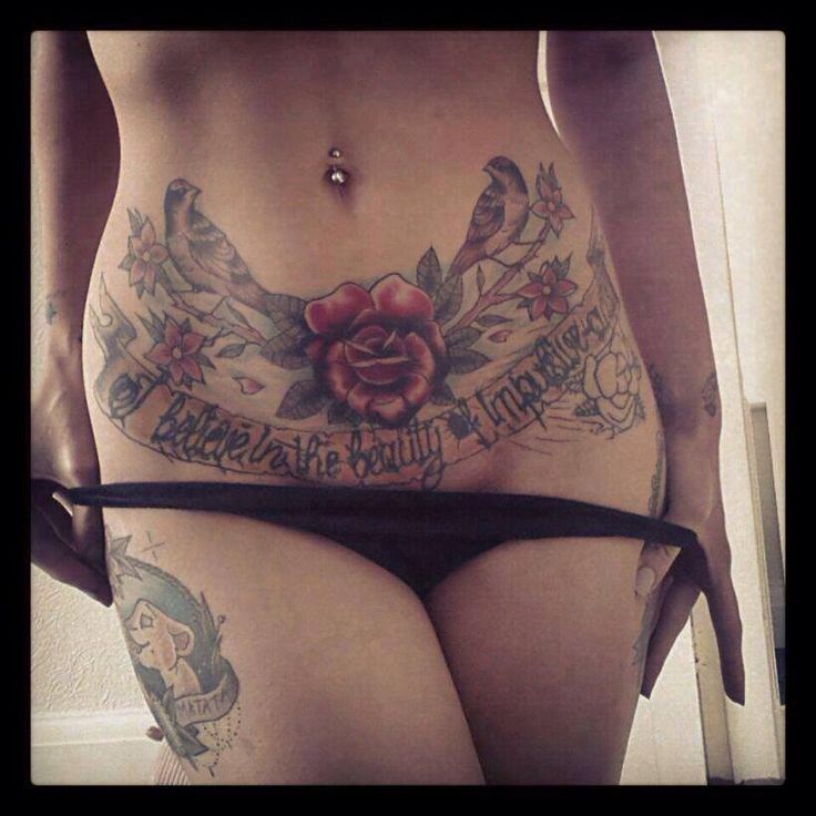 Red Rose With Two Birds And Banner Tattoo On Girl Stomach