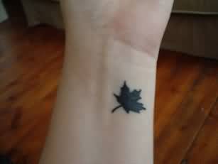 Silhouette Little Maple Leaf Tattoo On Wrist