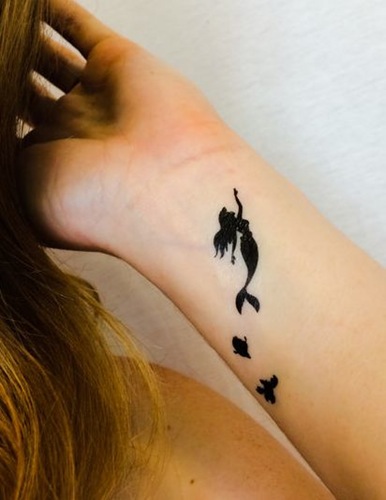 Silhouette Mermaid Tattoo On Girl Wrist