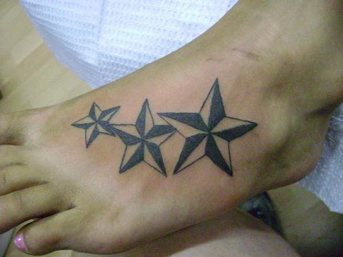 Three Black Nautical Star Tattoo On Girl Foot