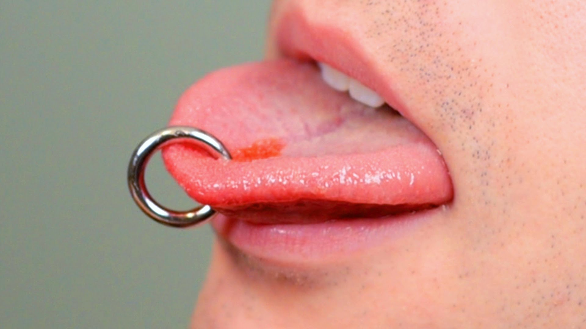 Tongue Piercing With Silver Ring