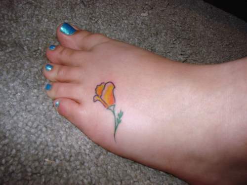 Yellow Tulip Flower Tattoo On Girl Left Foot