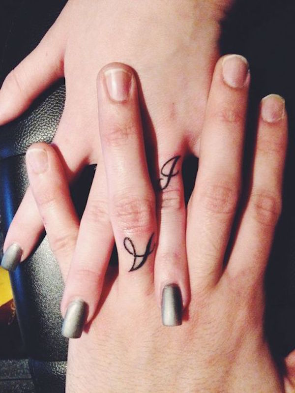 A And J Word Wedding Ring Tattoo On Couple Finger