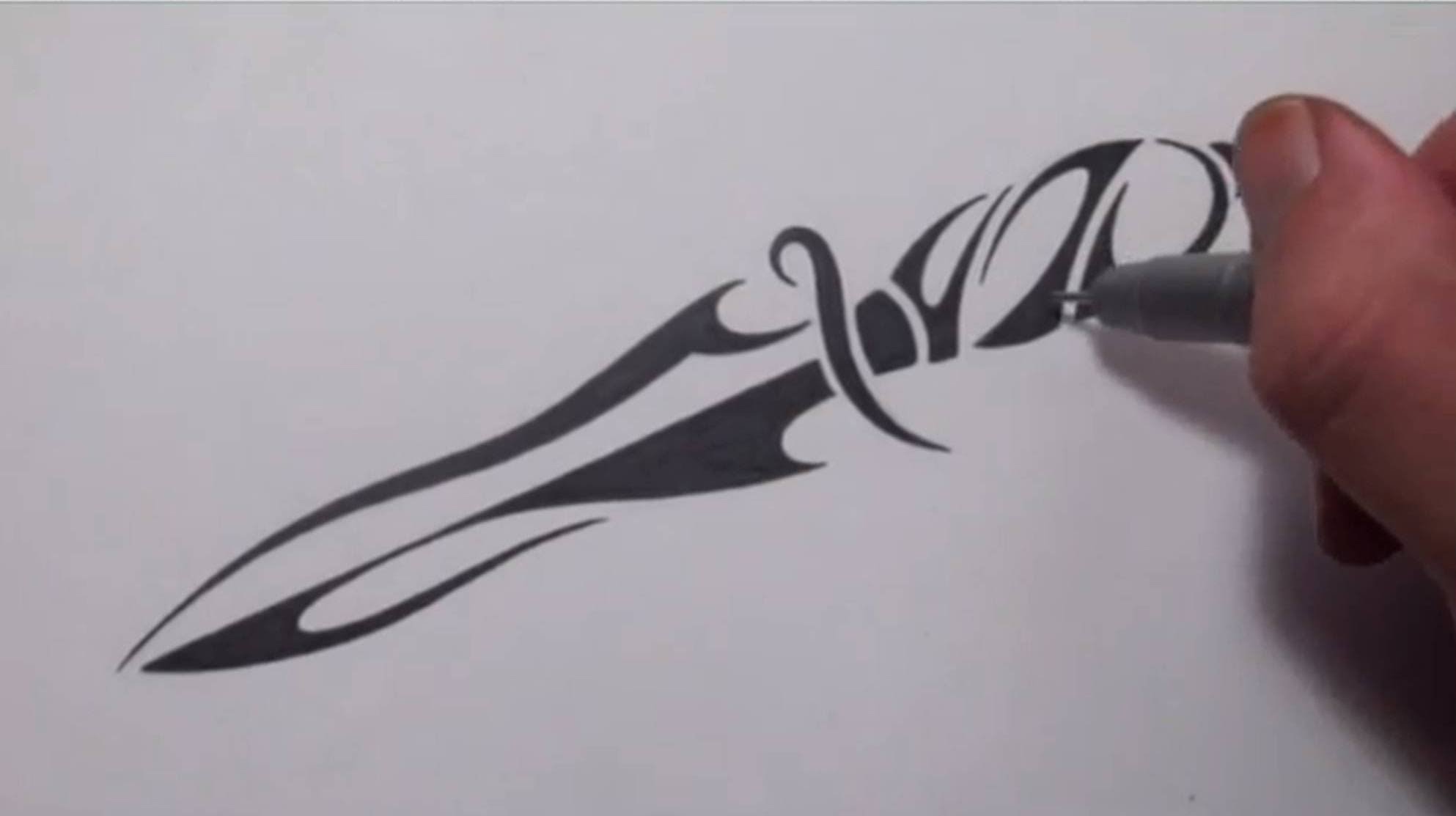 Amazing Black Tribal Knife Tattoo Design