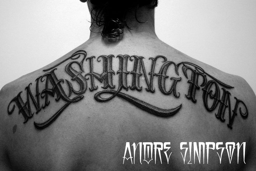 Amazing Black Washington Lettering Tattoo On Upper Back By Andre Simpson