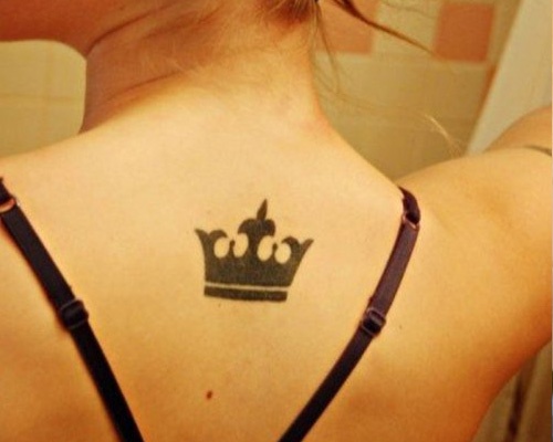 Awesome Black Crown Tattoo On Girl Upper Back