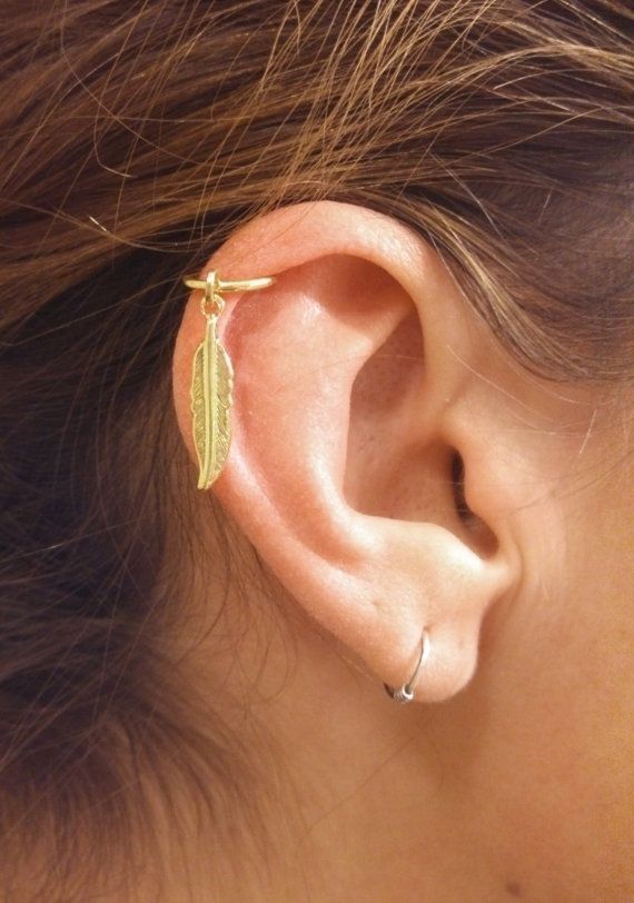 Beautiful Ear Lobe And Cartilage Feather Piercing