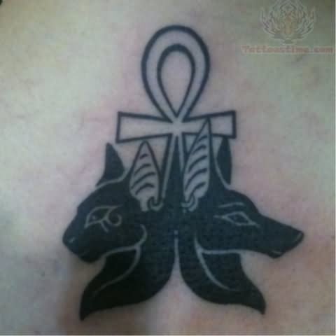 Black And Grey Ankh With Two Bastet Head Tattoo Design