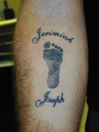 Black And Grey Baby Footprint Tattoo Design Forearm