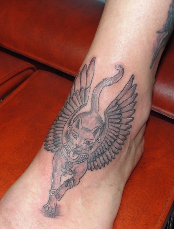 Black And Grey Bastet With Wings Tattoo On Foot By Lynne