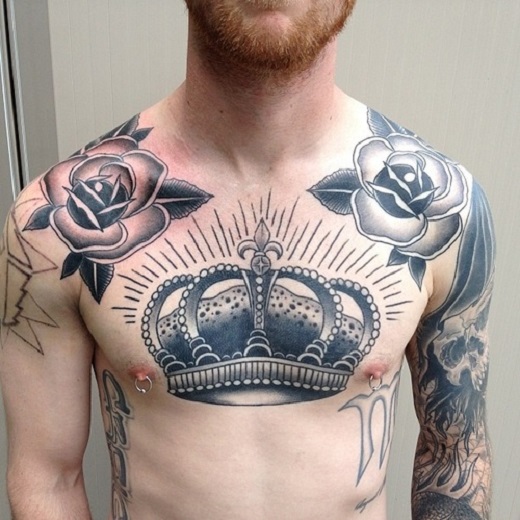 Black And Grey Crown With Roses Tattoo On Man Chest