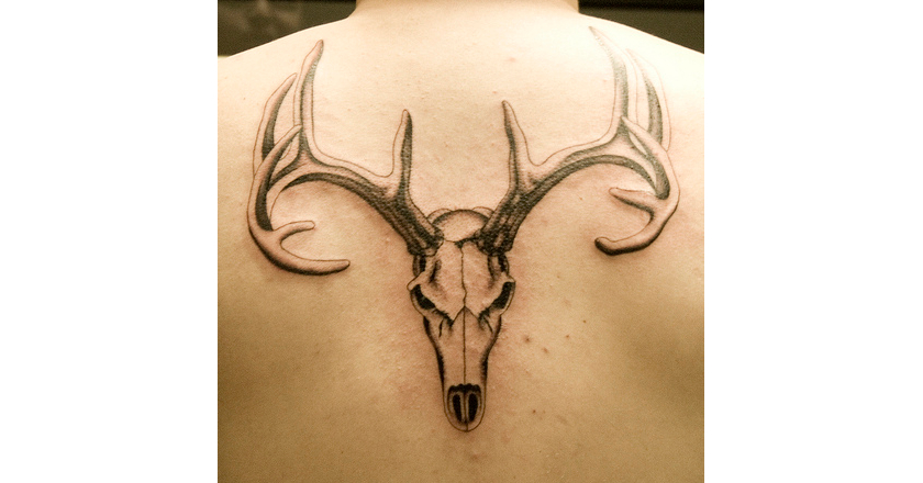 Black And Grey Deer Head Tattoo On Man Upper Back