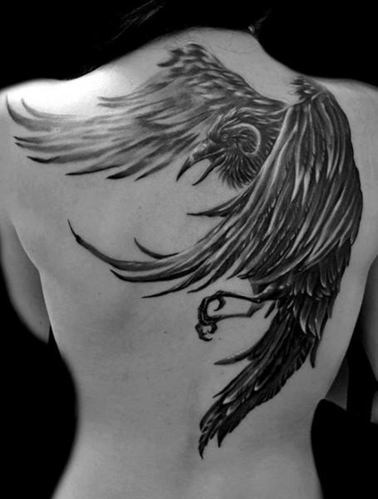 Black And Grey Flying Raven Tattoo On Girl Upper Back