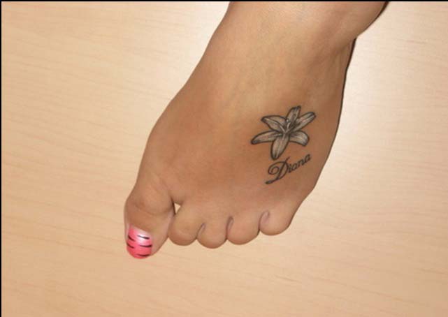 Black And Grey Little Lily Flower Tattoo On Girl Foot