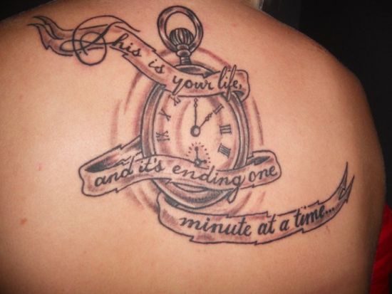 Black And Grey Pocket Watch With Banner Tattoo On Upper Back