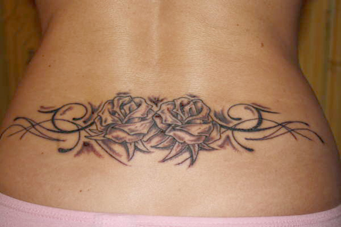 Black And Grey Two Roses With Swirl Tattoo On Lower Back