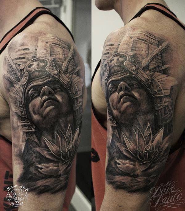Black And Grey Warrior Face Tattoo On Man Left Half Sleeve