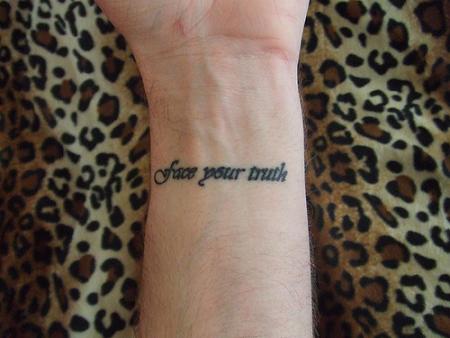 Black Face Your Truth Lettering Tattoo On Wrist