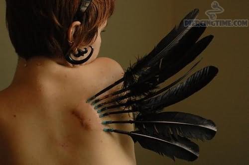 Black Feathers Piercings On Girl Back