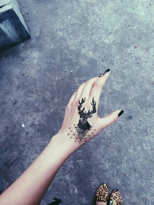 Black Geometric Deer Head Tattoo On Girl Hand
