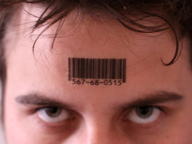 Black Ink Barcode Tattoo On Man Forehead