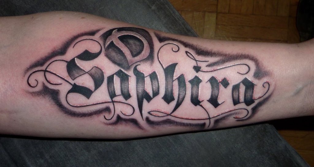 Black Ink Saphira Lettering Tattoo On Forearm By Privat Acc